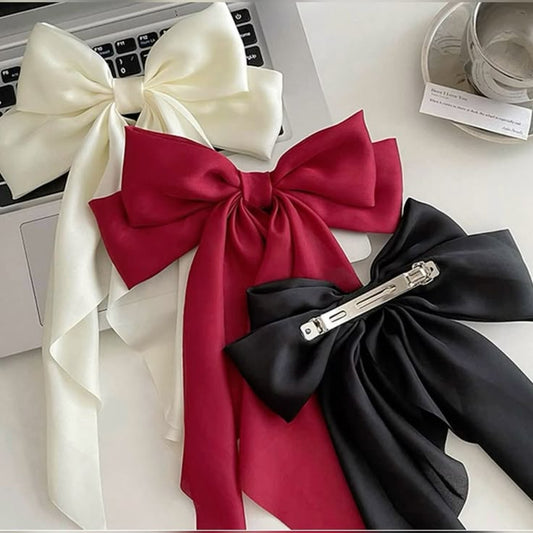 Three large satin bows in white, red, and black on a desk with a laptop. #tivra #tivracreation
#BowScarfHairclip #HairScarfBow #BowHairClip #ScarfHairClip #HairAccessories #BowClip #BowStyle #HairClipLove #TrendyHairClips #CuteHairAccessories
#HairStyleInspo #HairGoals #FashionHairAccessories #EverydayStyle #HairClipTrend #OOTDAccessories #StylishHairClips #HairClipStyle
#ShopWithUs #OnlineShoppingIndia #ShopOnlineNow #AffordableAccessories #ShopTheLook #