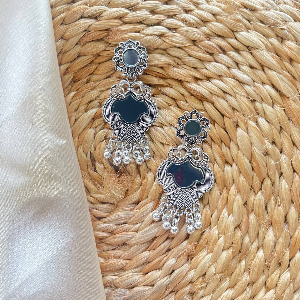 Pair of silver and black earrings on a woven mat Chandni oxidized earrings #MustHaveAccessories
#AccessorizeYourLook
#JewelleryLove
#DailyWearJewellery
#StatementEarrings
#TrendingEarrings #ShopifyStore
#AmazonFindsIndia
#FlipkartFinds
#MeeshoFinds
#OnlineShoppingIndia
#TrendingNowIndia
#SellerOnAmazon
#SmallBusinessIndia #MeenaTaraEarrings
#MeenaEarrings
#TaraEarrings
#OxidizedEarrings
#OxidisedJewellery
#OxidisedEarrings
#GermanSilverEarrings
#MeenakariJewellery
#MeenaJewellery
#HandcraftedEarrin
