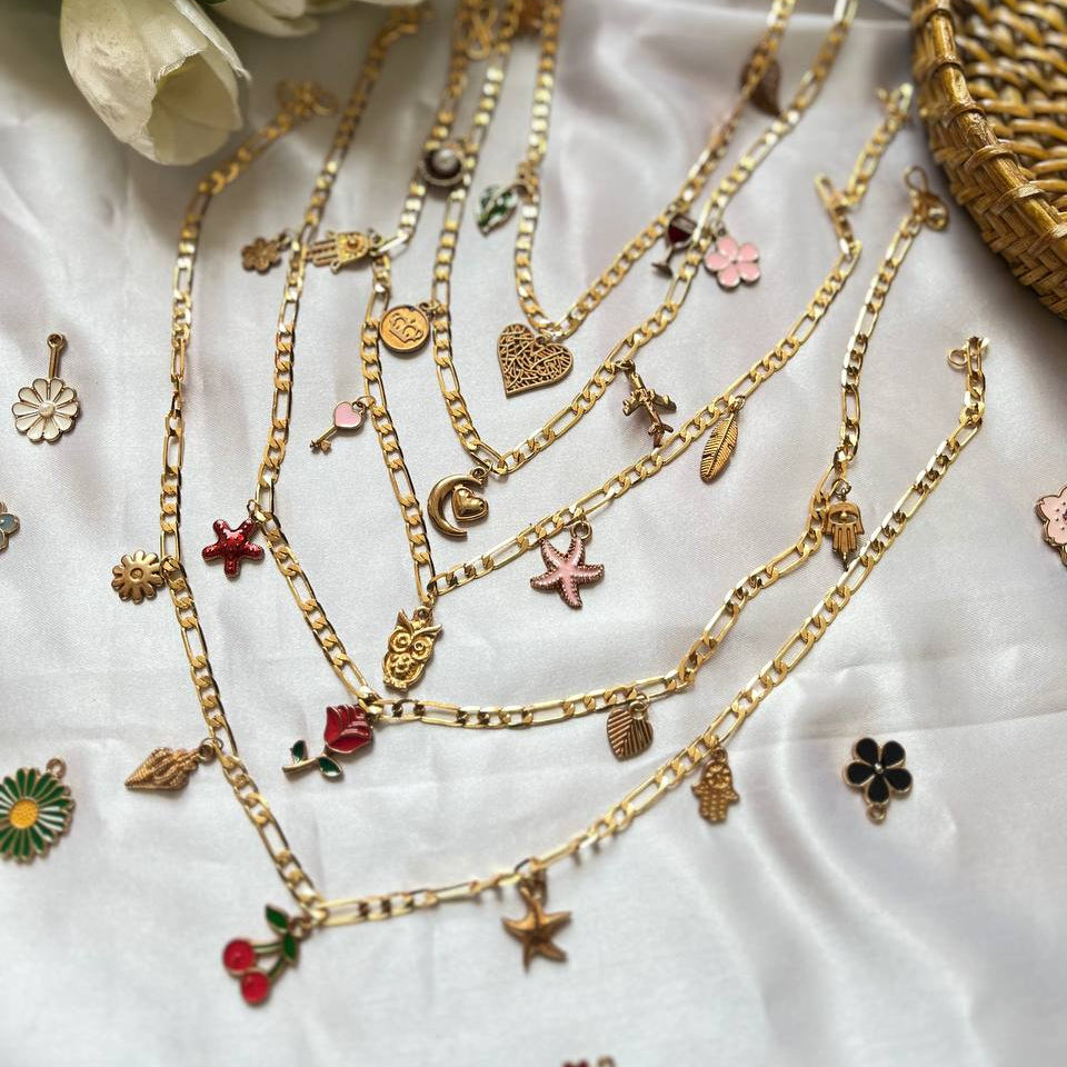 Gold necklaces with various charms on a white fabric background with flowers and a woven basket. #charmnecklace 
#charmnecklace
#charmneckpieces
#charmpendant
#pendantnecklace
#daintynecklace
#minimaljewelry
#fashionjewelry
#jewelryaddict
#jewelrylove
#trendyjewelry #koreanstylejewelry
#everydayjewelry
#giftforher
#cutenecklace
#personalizednecklace
#minimalstyle
#fashionaccessories
#stylishneckpieces
#affordablejewelry #shopifyindia
#amazonfinds
#amazonfashionindia
#flipkartfashion
#tivra #tivracreation