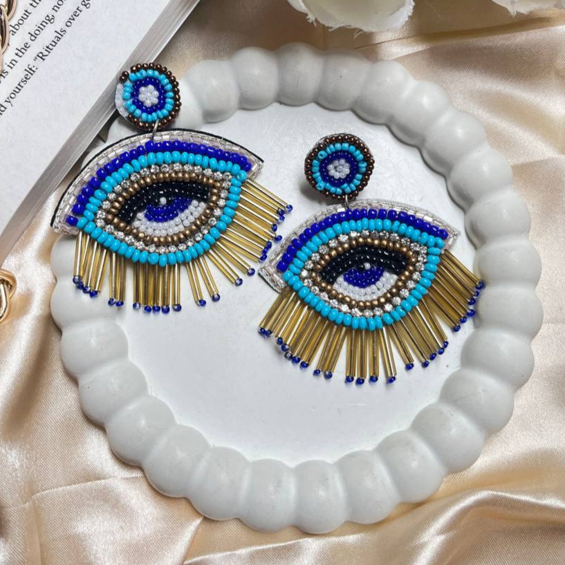 Evil Third Eye Handmade Beaded Earrings #handmadejewelry #tivra #tivracreation #beadedjewelry
#handmadeearrings #beadedearrings #jewelrydesigner
#uniquejewelry #oneofakind
#crystaljewelry #gemstones