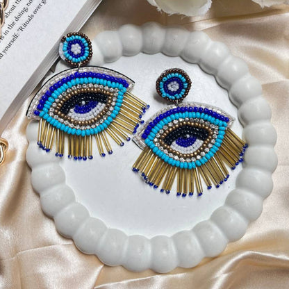 Evil Third Eye Handmade Beaded Earrings #handmadejewelry #tivra #tivracreation #beadedjewelry
#handmadeearrings #beadedearrings #jewelrydesigner
#uniquejewelry #oneofakind
#crystaljewelry #gemstones