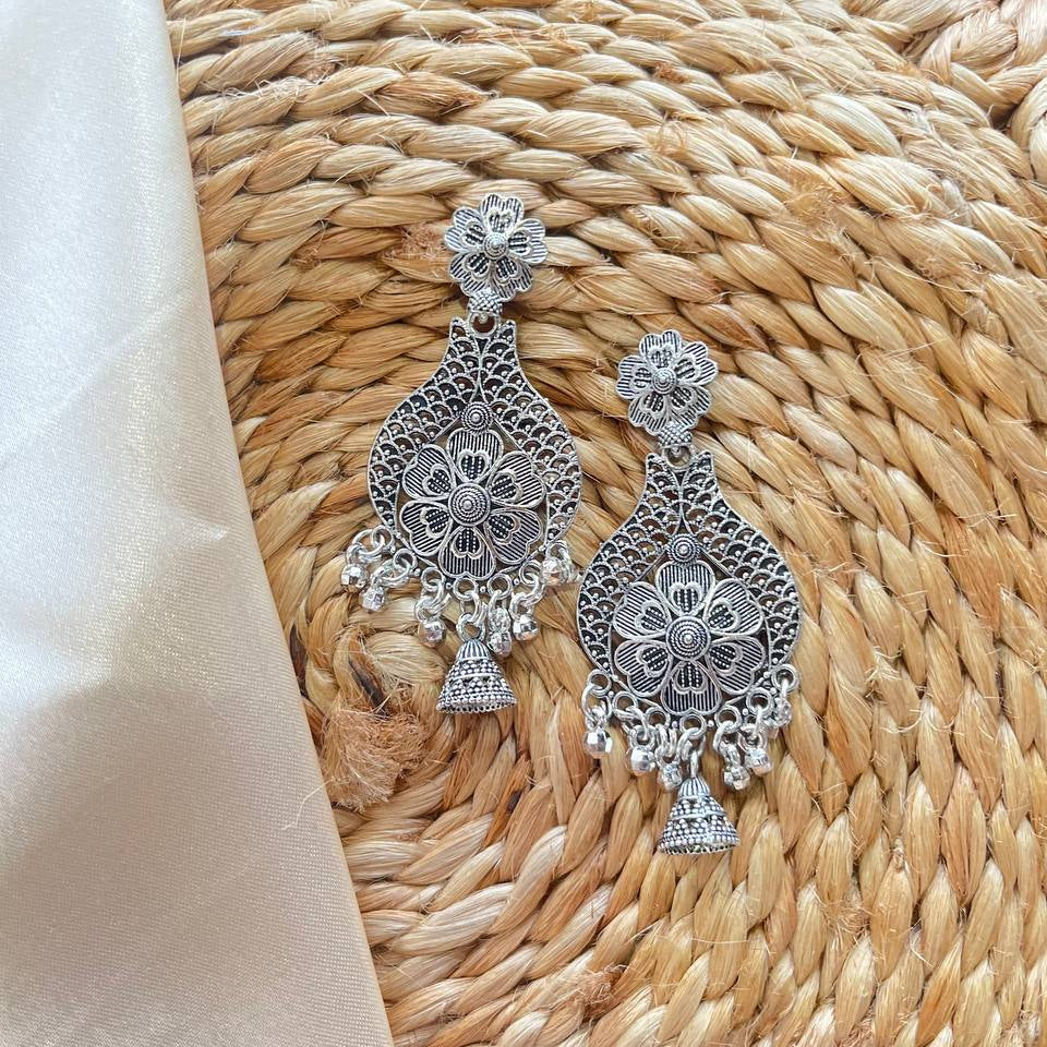Silver earrings on a woven mat Florika Oxidized Earrings #MeenaTara
#Oxidized
#BohoVibes
#SilverVibes
#DesiVibes #ShopifyStore
#AmazonFindsIndia
#FlipkartFinds
#MeeshoFinds
#OnlineShoppingIndia
#TrendingNowIndia
#SellerOnAmazon #tivra #tivracreation
#SmallBusinessIndia