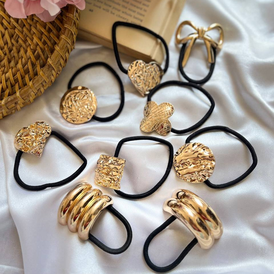 Gold hair tie holders with decorative ends on a white fabric background Metal Rubber Band #PonyCuffs
#MetalHairBands
#PonytailAccessories
#HairCuffs
#PremiumHairAccessories
#AntiTarnishAccessories
#MetalPonyCuffs
#LuxuryHairAccessories
#HairBandTies
#TrendyHairAccessories
#HairFashion
#AccessorizeYourLook
#MinimalLuxury
#ChicStyle
#ElegantAccessories
#FashionDaily
#StyleInspo
#ModernAccessories
#TivraCreation
#TIVRACREATION
#MadeInIndia
#IndianBrand
#IndianSeller
#DesiFashion
#PremiumIndianBrand
