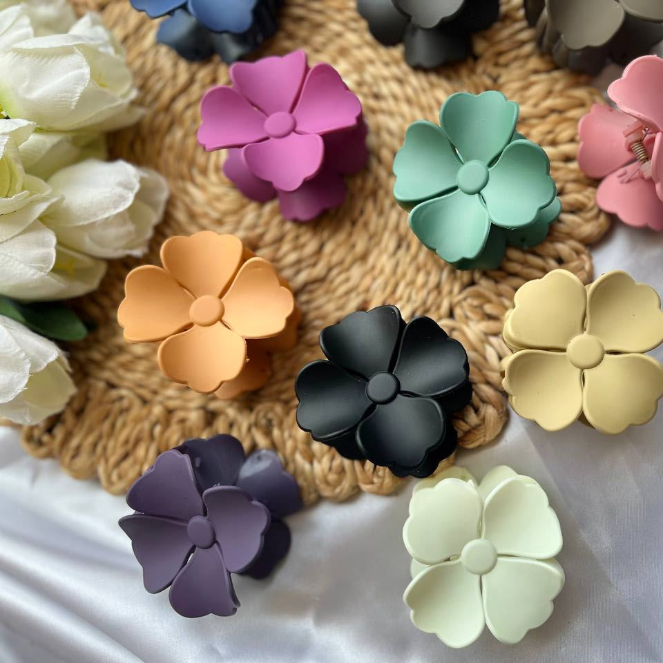 Tivra Creation Blossom Grip Claws/Clutcher/Hairclips Colorful flower-shaped objects on a textured surface with flowers in the background 
#IndianAccessoryBrand
#EverydayAccessories
#ElegantHairClips
#HairClipGoals
#TrendyHairClaws
#WhiteClawClip
#StyleWithTivra
#AccessoryOfTheDay
#InstaHairStyle
#HairStyleAccessories
#AestheticClips
#OOTDIndia