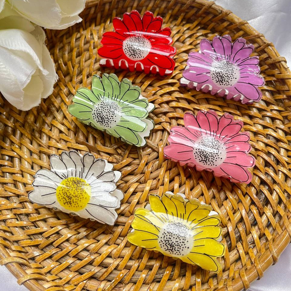Colorful flower-shaped hair clips on a woven mat with white flowers in the background #sunflowerclawclip
#sunflowerhairclip
#clawcliptrend
#hairaccessoriesindia
#hairclipsforsale
#sunfloweraesthetic
#summerhairaccessories
#trendyhairclips
#cutehairclips
#handmadehairclips
#smallbusinessindia
#hairaccessoriesstore
#dailyhairaccessories
#pinterestinspiredhair
#haircareaccessories
#floralhairclips
#shoplocalindia
#onlinestoresindia
#fashionaccessoriesindia
#tivracreation